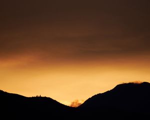 Preview wallpaper hills, silhouettes, sunset, sky, dusk, evening