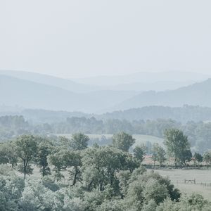 Preview wallpaper hills, trees, fog, horizon, landscape