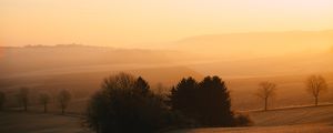 Preview wallpaper hills, trees, fog, dusk, morning, landscape