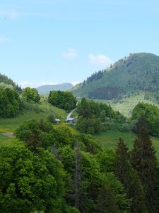Preview wallpaper hills, trees, houses, sky, nature