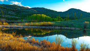 Preview wallpaper hills, trees, lake, grass, landscape, nature