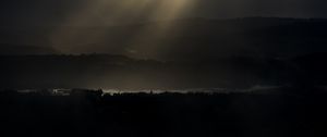 Preview wallpaper hills, trees, river, light, clouds, dark