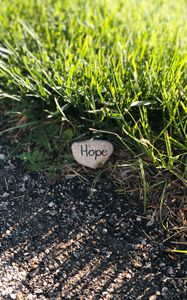 Preview wallpaper hope, inscription, grass, stone