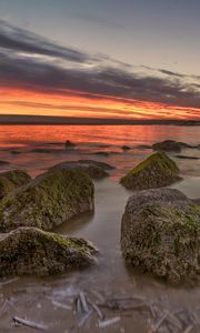 Preview wallpaper horizon, sunset, stones, shore
