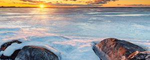 Preview wallpaper horizon, sunset, stones, ice, snow