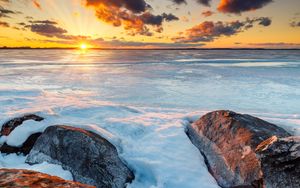 Preview wallpaper horizon, sunset, stones, ice, snow