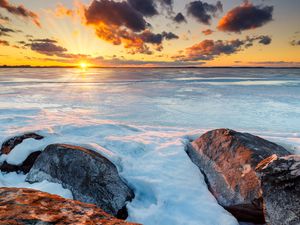 Preview wallpaper horizon, sunset, stones, ice, snow