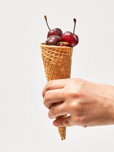 Preview wallpaper horn, cherry, berries, dessert, hand