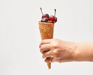 Preview wallpaper horn, cherry, berries, dessert, hand