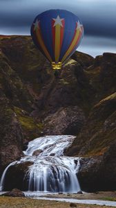 Preview wallpaper hot air balloon, mountains, rocks, waterfall