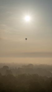 Preview wallpaper hot air balloon, sky, sun, light, forest, trees, fog