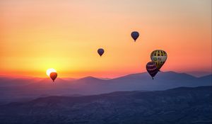 Preview wallpaper hot air balloons, mountains, sunrise, fog