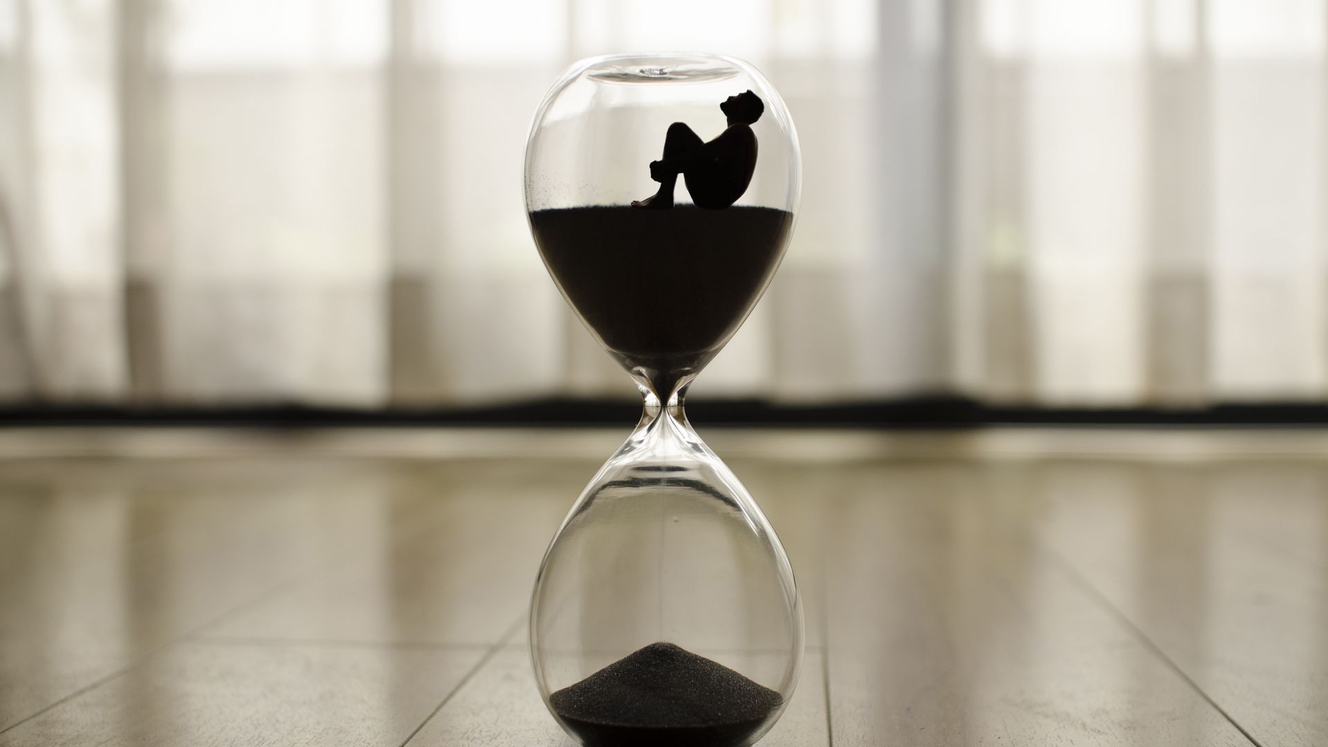 Download wallpaper 1920x1080 hourglass, man, time, loneliness full hd,  hdtv, fhd, 1080p hd background
