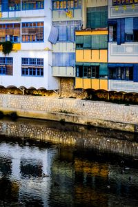 Preview wallpaper house, balconies, facade, water, colorful