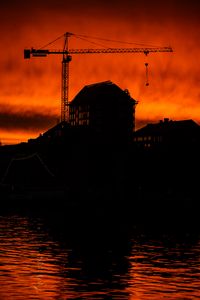 Preview wallpaper house, building, crane, silhouette, sunset, dark