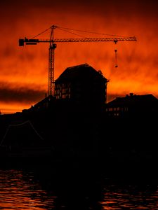 Preview wallpaper house, building, crane, silhouette, sunset, dark