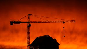 Preview wallpaper house, building, crane, silhouette, sunset, dark