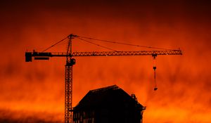 Preview wallpaper house, building, crane, silhouette, sunset, dark