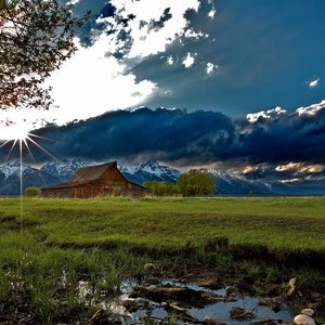 Preview wallpaper house, field, clouds, shadows, light, sun, beams, tree