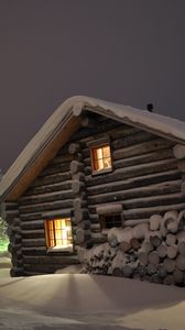 Preview wallpaper house, light, windows, winter, snowdrifts, logs