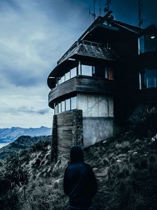 Preview wallpaper house, man, hood, alone, solitude, mountains, christchurch, new zealand