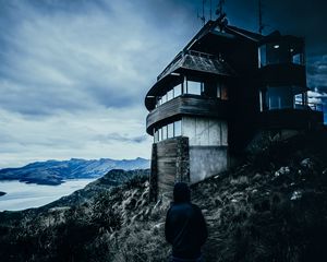 Preview wallpaper house, man, hood, alone, solitude, mountains, christchurch, new zealand