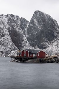 Preview wallpaper house, mountains, island, sea, snow