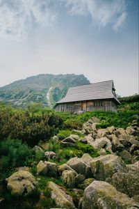 Preview wallpaper house, mountains, nature, stones, slope