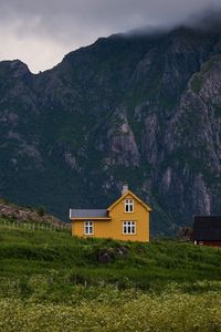 Preview wallpaper house, mountains, solitude, grass, clouds