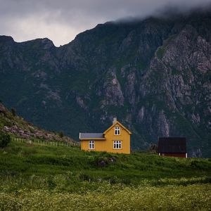 Preview wallpaper house, mountains, solitude, grass, clouds