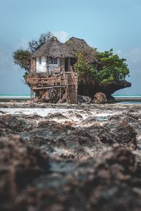 Preview wallpaper house, rock, beach, coast, ocean