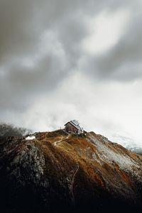Preview wallpaper house, rocks, cliff, path, clouds
