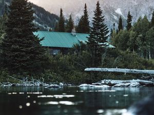 Preview wallpaper house, roof, trees, pond, mountain