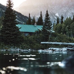 Preview wallpaper house, roof, trees, pond, mountain