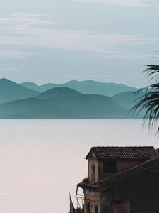 Preview wallpaper house, sea, mountains, fog, building, shore