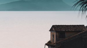 Preview wallpaper house, sea, mountains, fog, building, shore