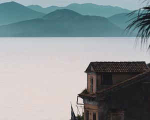 Preview wallpaper house, sea, mountains, fog, building, shore