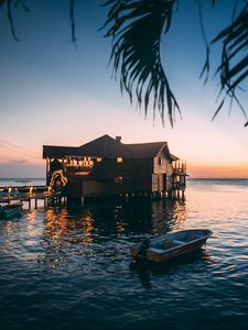 Preview wallpaper house, sea, sunset, branch, water