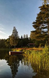 Preview wallpaper houses, boat, lake, forest, sky