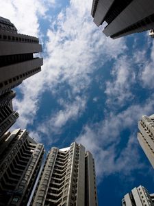 Preview wallpaper houses, bottom view, sky, clouds