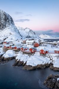 Preview wallpaper houses, coast, mountains, snow, island, sea