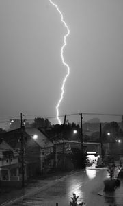 Preview wallpaper houses, lightning, bw, road