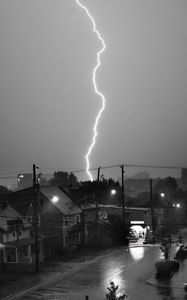 Preview wallpaper houses, lightning, bw, road