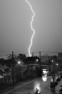 Preview wallpaper houses, lightning, bw, road