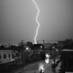 Preview wallpaper houses, lightning, bw, road