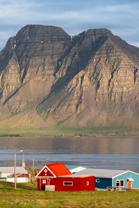 Preview wallpaper houses, mountain, rock, lake, sky