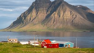 Preview wallpaper houses, mountain, rock, lake, sky