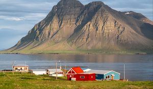 Preview wallpaper houses, mountain, rock, lake, sky