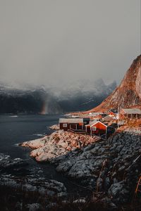 Preview wallpaper houses, mountains, fog, rainbow, lofoten, norway
