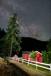 Preview wallpaper houses, path, fence, forest, stars, night